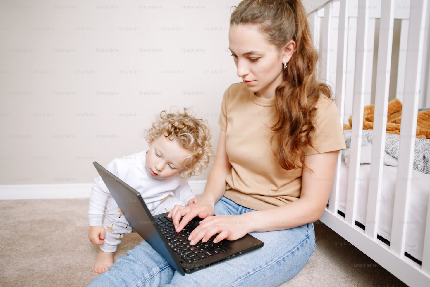 Mom with child using laptop